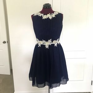 Elegant navy blue and ivory chiffon dress. US 10.